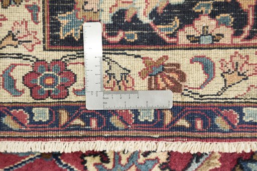 Corner detail of 1960s Mashad rug showing border pattern and Wool pile