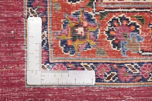 Corner detail of 1960s Mashad rug showing border pattern and Wool pile
