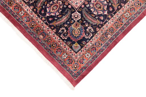 Backside of handmade 1960s Mashad rug showing knot structure and weave density