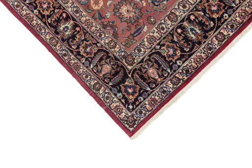 Backside of handmade 1960s Mashad rug showing knot structure and weave density