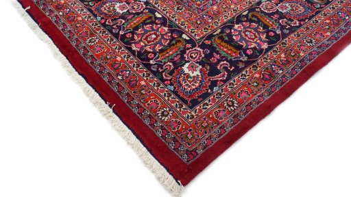 Backside of handmade 1960s Mashad rug showing knot structure and weave density