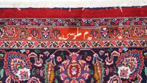 Close-up detail of 1960s Mashad rug from Iran / Persia showing Wool weave