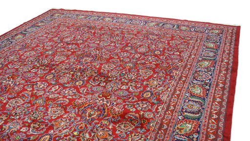 Surface texture of 1960s Mashad rug with natural Wool and intricate pattern