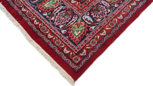 Backside of handmade 1960s Mashad rug showing knot structure and weave density
