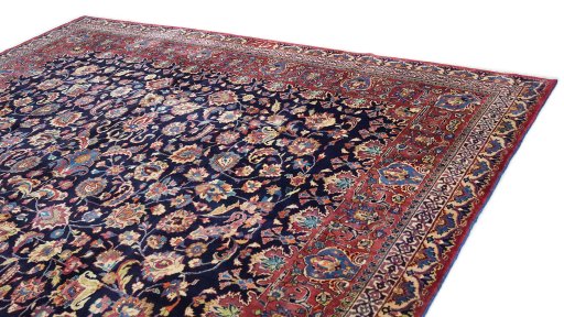 Surface texture of 1960s Mashad rug with natural Wool and intricate pattern