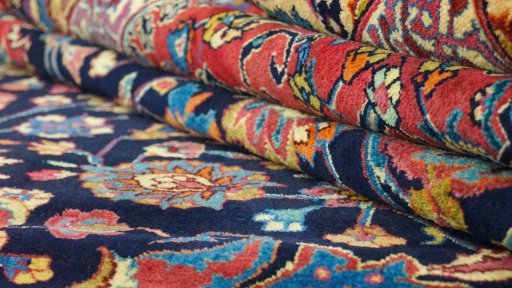 Full view of 1960s Mashad rug from Iran / Persia, 498 × 335 cm in Dark blue tones
