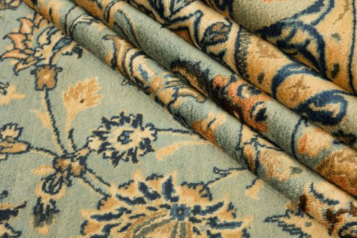 Corner detail of 1980s Mashad rug showing border pattern and Wool pile