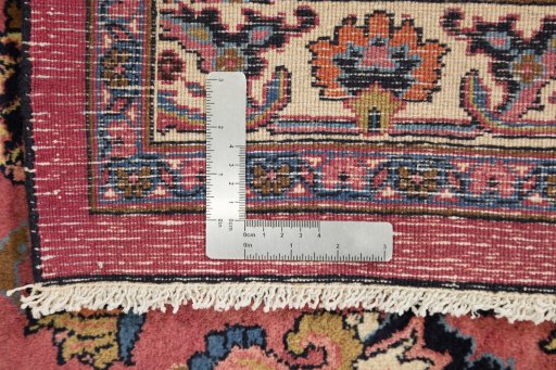 Full view of 1960s Mashad rug from Iran / Persia, 406 × 307 cm in Red tones