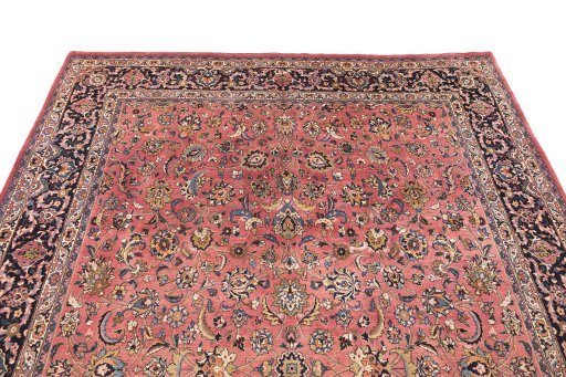 Surface texture of 1960s Mashad rug with natural Wool and intricate pattern