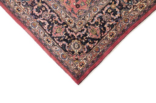 Backside of handmade 1960s Mashad rug showing knot structure and weave density
