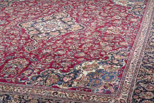 Surface texture of 1970s Mashad rug with natural Wool and intricate pattern