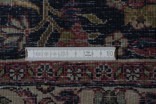 Close-up detail of 1970s Mashad rug from Iran / Persia showing Wool weave