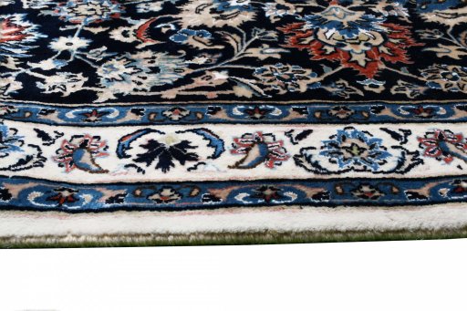 Close-up detail of New Mashad rug from Iran / Persia showing Wool weave