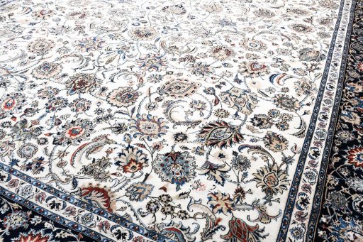 Backside of handmade New Mashad rug showing knot structure and weave density