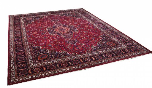 Corner detail of 1950s Mashad rug showing border pattern and Wool pile
