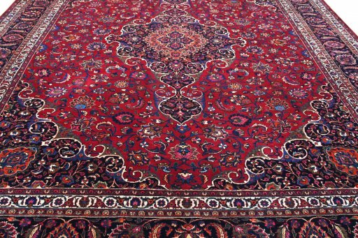 Surface texture of 1950s Mashad rug with natural Wool and intricate pattern