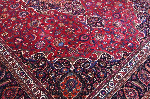 Backside of handmade 1950s Mashad rug showing knot structure and weave density