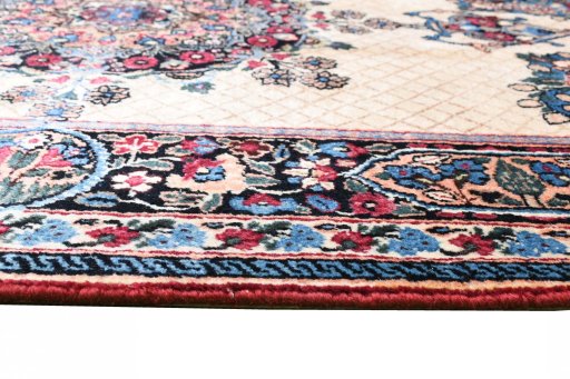 Backside of handmade 1950s Mashad rug showing knot structure and weave density
