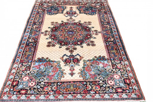 Surface texture of 1950s Mashad rug with natural Wool and intricate pattern