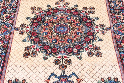 Central medallion detail of 1950s Mashad rug from Iran / Persia