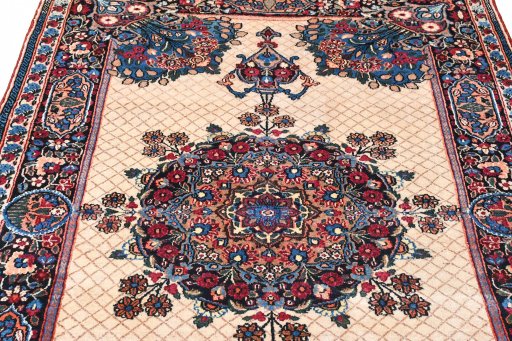 Full view of 1950s Mashad rug from Iran / Persia, 198 × 129 cm in Beige tones