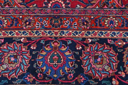 Corner detail of 1950s Mashad rug showing border pattern and Wool pile