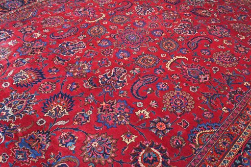 Surface texture of 1950s Mashad rug with natural Wool and intricate pattern