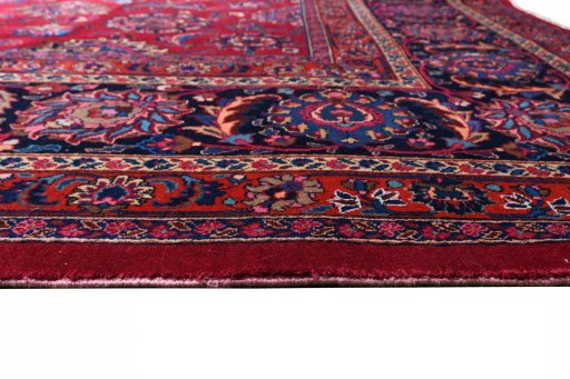 Corner detail of 1950s Mashad rug showing border pattern and Wool pile