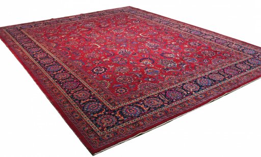 Corner detail of 1950s Mashad rug showing border pattern and Wool pile