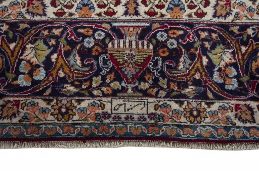Corner detail of 1970s Mashad rug showing border pattern and Wool pile