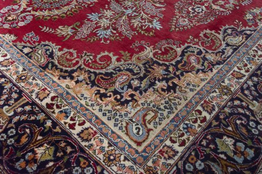 Full view of 1970s Mashad rug from Iran / Persia, 387 × 300 cm in Red tones