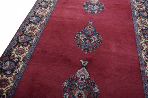 Backside of handmade 1950s Mashad rug showing knot structure and weave density