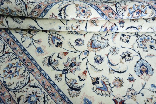 Close-up detail of New Mashad rug from Iran / Persia showing Wool weave