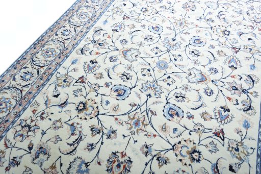 Backside of handmade New Mashad rug showing knot structure and weave density