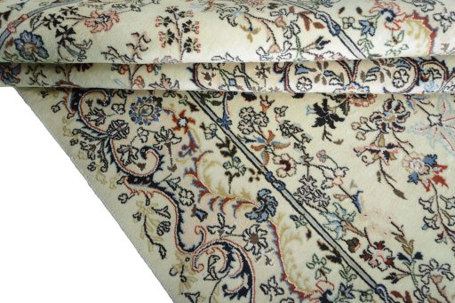 Close-up detail of New Mashad rug from Iran / Persia showing Wool weave