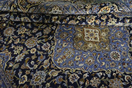 Close-up detail of 2000s Mashad rug from Iran / Persia showing Wool weave