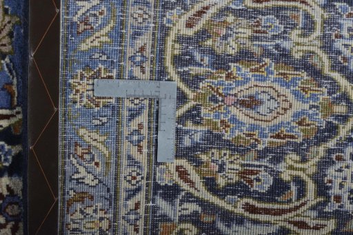 Backside of handmade 2000s Mashad rug showing knot structure and weave density