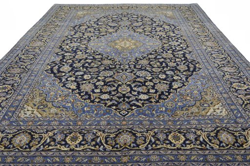 Surface texture of 2000s Mashad rug with natural Wool and intricate pattern