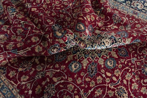 Backside of handmade 2000s Mashad rug showing knot structure and weave density