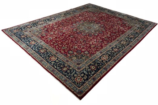 Corner detail of 2000s Mashad rug showing border pattern and Wool pile