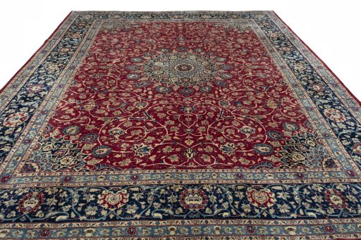 Surface texture of 2000s Mashad rug with natural Wool and intricate pattern