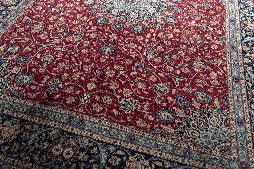 Close-up detail of 2000s Mashad rug from Iran / Persia showing Wool weave