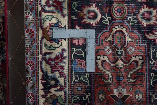Backside of handmade 2000s Mashad rug showing knot structure and weave density