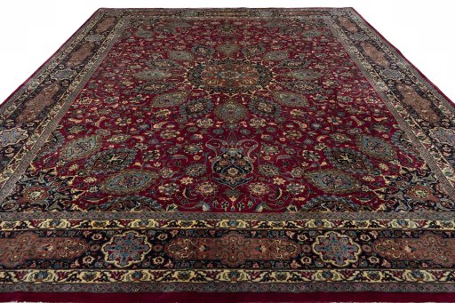 Surface texture of 2000s Mashad rug with natural Wool and intricate pattern