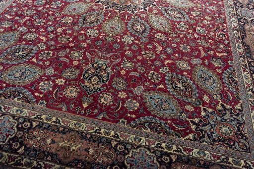 Close-up detail of 2000s Mashad rug from Iran / Persia showing Wool weave