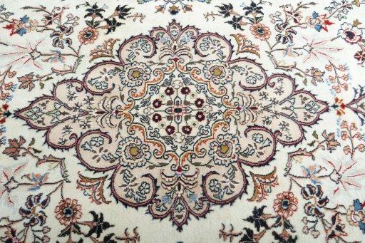 Central medallion detail of New Mashad rug from Iran / Persia