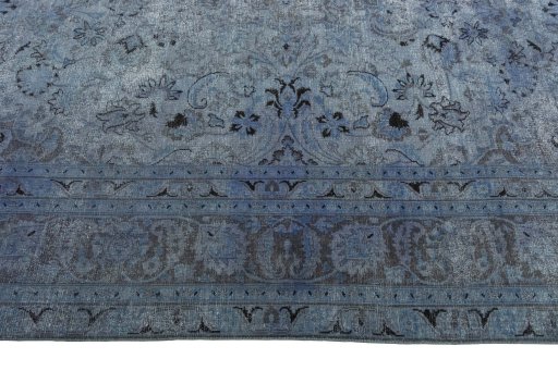 Corner detail of 1950s Mashad rug showing border pattern and Wool pile