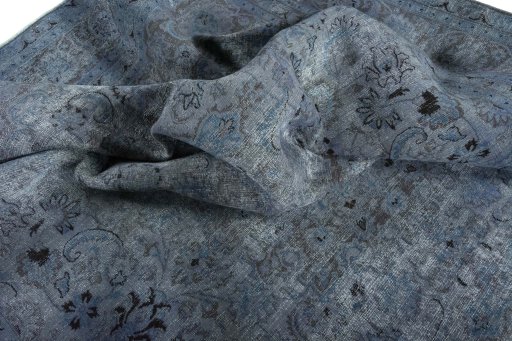 Surface texture of 1950s Mashad rug with natural Wool and intricate pattern