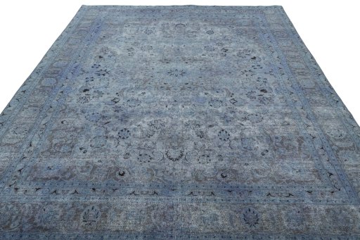 Surface texture of 1950s Mashad rug with natural Wool and intricate pattern