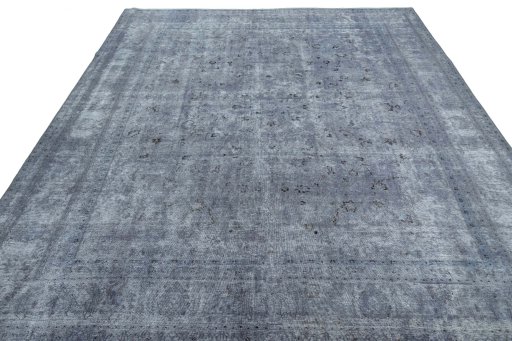 Surface texture of 1950s Mashad rug with natural Wool and intricate pattern